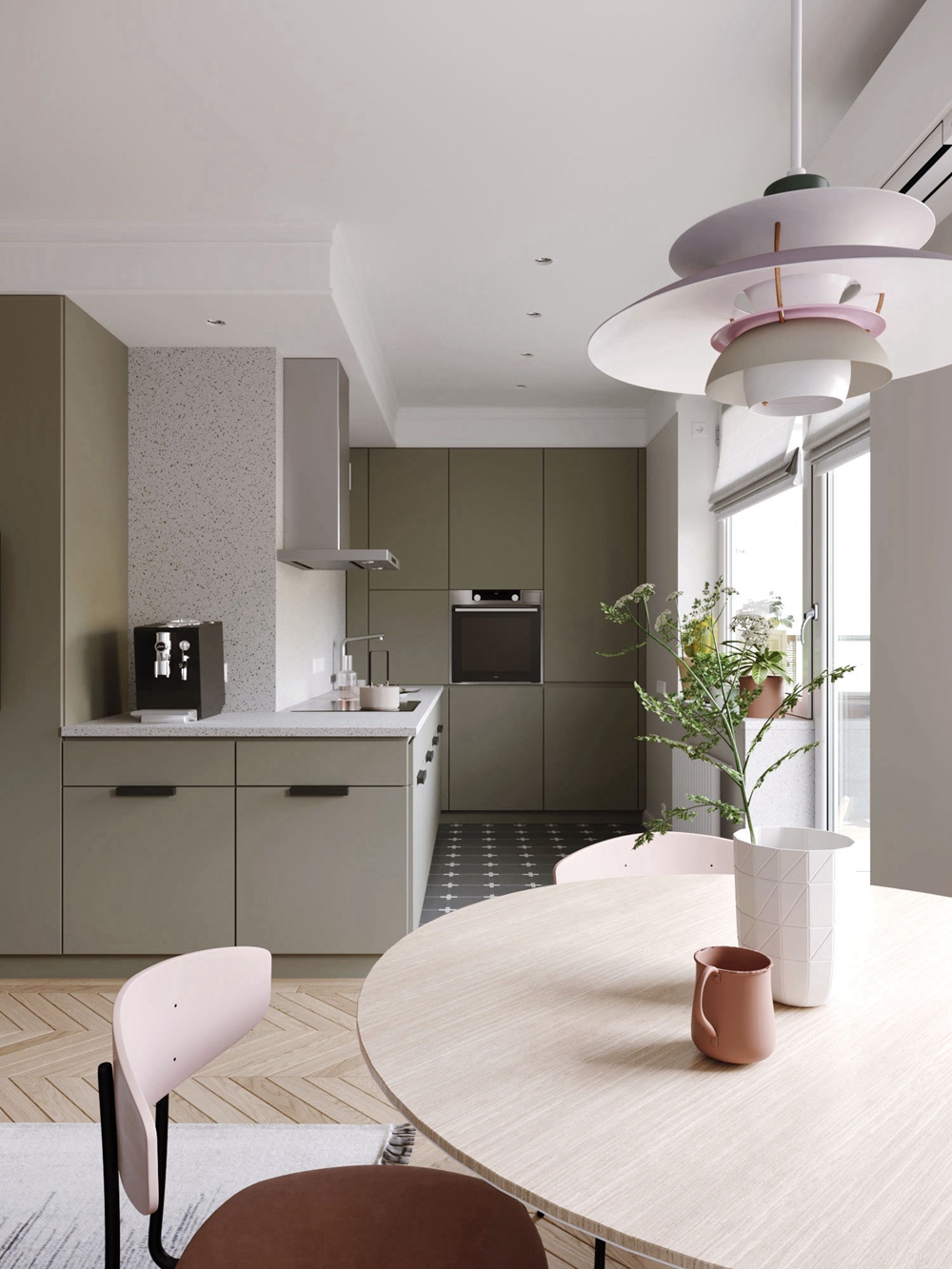 餐桌对面就是厨房，橄榄绿橱柜搭配白色厨电，简约又大气，视野宽敞又透亮。