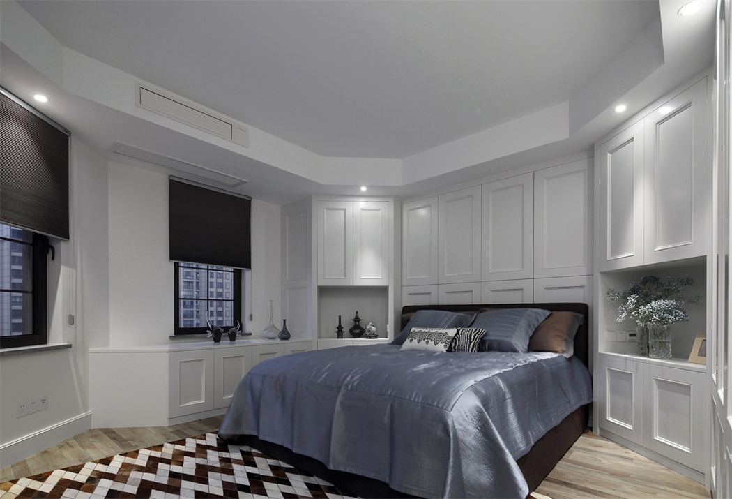 卧室以白色为主，墙面多用护墙板设计，射灯与柜面搭配，营造出一个简洁优雅的静谧空间。