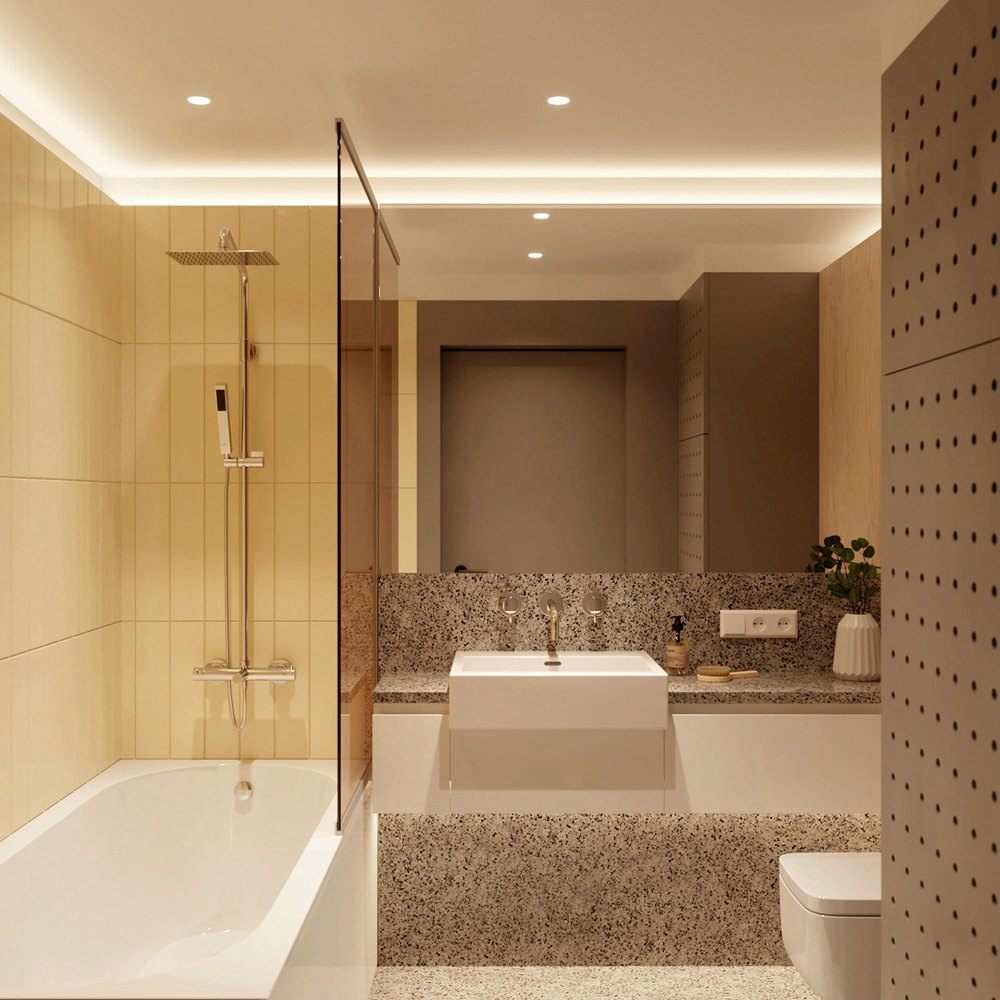 卫生间精致而明亮，局部采用了干湿分离设计，金色洗手池使空间色彩层次丰富而又有现代感。